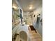 Bright bathroom featuring a walk-in shower with safety features and grab bars at 5022 Wrenn Dr, Denver, NC 28037