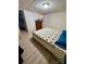 Bright bedroom featuring laminated floors and closet with ample storage at 5022 Wrenn Dr, Denver, NC 28037