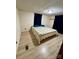 Comfortable bedroom with laminated floors and large window at 5022 Wrenn Dr, Denver, NC 28037