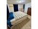 Inviting bedroom with light laminated floors, ample closet space, and furnishings at 5022 Wrenn Dr, Denver, NC 28037