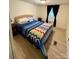 This bedroom has carpet and a window at 5022 Wrenn Dr, Denver, NC 28037