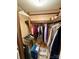 A walk in closet with plenty of storage and wood shelves at 5022 Wrenn Dr, Denver, NC 28037