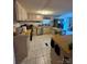 Functional kitchen with white cabinets, stainless steel appliances, and tiled floor at 5022 Wrenn Dr, Denver, NC 28037