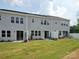 Spacious backyard with lush green grass, patio area, and views of the surrounding neighborhood at 507 Webster Ln, Cramerton, NC 28032