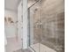 Modern shower featuring beautiful gray tile and glass door at 507 Webster Ln, Cramerton, NC 28032