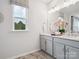 Bright bathroom with dual sinks, gray cabinetry, and ample counter space at 507 Webster Ln, Cramerton, NC 28032