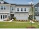 New two-story home featuring a two-car garage, manicured lawn, and classic gray siding at 507 Webster Ln, Cramerton, NC 28032