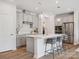 Modern kitchen featuring a spacious island, stainless steel appliances, and light gray cabinetry at 507 Webster Ln, Cramerton, NC 28032