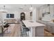 Contemporary kitchen featuring an island with seating, pendant lighting, gray cabinets, and an open layout at 507 Webster Ln, Cramerton, NC 28032