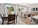 Open-concept living room and dining area features large windows and modern furnishings at 507 Webster Ln, Cramerton, NC 28032