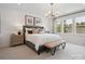 Bright main bedroom features windows, neutral tones, and refined decor at 507 Webster Ln, Cramerton, NC 28032