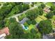 Aerial view of the house with a pool surrounded by mature trees and a spacious yard at 6313 Weddington Rd, Concord, NC 28027