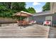Spacious back deck featuring an outdoor dining set, comfortable seating, and a shaded canopy at 6313 Weddington Rd, Concord, NC 28027