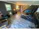 Basement workout area featuring wood-look floors and exercise equipment at 6313 Weddington Rd, Concord, NC 28027