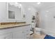 This bathroom features white cabinets, granite countertops, and a shower/tub combo at 6313 Weddington Rd, Concord, NC 28027