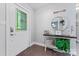 Inviting entryway with a decorative door, hardwood floors, and charming decor at 6313 Weddington Rd, Concord, NC 28027
