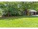 Charming single-Gathering home with well-maintained lawn and mature trees at 6313 Weddington Rd, Concord, NC 28027