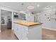 Bright kitchen with butcher block island, open to living area at 6313 Weddington Rd, Concord, NC 28027