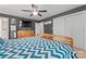 This main bedroom features a ceiling fan, a TV, and a closet with plenty of storage space at 6313 Weddington Rd, Concord, NC 28027