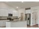 Modern kitchen with granite countertops, stainless steel appliances, a kitchen island and white cabinets at 7217 Jerimoth Dr, Charlotte, NC 28215