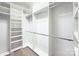 A very large and well organized walk-in closet featuring many built-in shelves and racks at 8044 Hawk Crest Ct, Charlotte, NC 28270