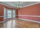 Bright dining room featuring hardwood floors and a bay window, offering ample natural light and a cozy atmosphere at 8044 Hawk Crest Ct, Charlotte, NC 28270
