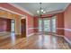 Elegant dining room with hardwood floors, bay window, and beautiful trim work, perfect for entertaining at 8044 Hawk Crest Ct, Charlotte, NC 28270