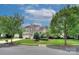 Charming two-story home with stone accents, beautiful landscaping, mature trees, and a well-manicured lawn at 8044 Hawk Crest Ct, Charlotte, NC 28270