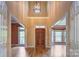 Grand foyer with high ceilings, hardwood floors, and a striking light fixture creates an elegant entrance at 8044 Hawk Crest Ct, Charlotte, NC 28270