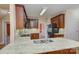 Well-appointed kitchen with stainless steel appliances, granite countertops, and wood cabinetry at 8044 Hawk Crest Ct, Charlotte, NC 28270