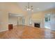 Living space features a fireplace and hardwood floors, open to the kitchen at 8044 Hawk Crest Ct, Charlotte, NC 28270