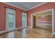 Inviting living room with hardwood floors and an open doorway, showcasing a seamless flow to other spaces at 8044 Hawk Crest Ct, Charlotte, NC 28270