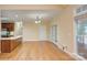 Open-concept living and dining area with wood floors and natural light at 8044 Hawk Crest Ct, Charlotte, NC 28270