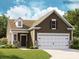 Charming one-story home with a two-car garage and well-manicured lawn at 8426 Norman Forest Rd, Lancaster, SC 29720