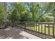 Expansive wooden deck offering scenic views of the lush, green backyard at 10101 Wood Ct, Charlotte, NC 28277