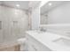 Bright bathroom featuring a double vanity, frameless glass shower, and neutral tones at 10101 Wood Ct, Charlotte, NC 28277