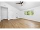 Spacious bedroom featuring a ceiling fan, hardwood floors, and great natural lighting at 10101 Wood Ct, Charlotte, NC 28277