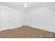 Bedroom featuring hardwood floors and neutral walls at 10101 Wood Ct, Charlotte, NC 28277