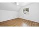 Bedroom featuring hardwood floors, great natural lighting, and a vaulted ceiling at 10101 Wood Ct, Charlotte, NC 28277