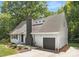 Charming home featuring a new roof, attached garage, freshly painted brick chimney, and lovely landscaping at 10101 Wood Ct, Charlotte, NC 28277