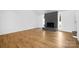 Bright living room features a unique stone fireplace, laminate flooring, and plenty of natural light at 10101 Wood Ct, Charlotte, NC 28277