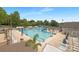 Large community swimming pool complete with lounge chairs and a water slide at 10101 Wood Ct, Charlotte, NC 28277
