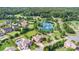 Aerial view of a neighborhood pond with three fountains, walking trails, and beautifully landscaped homes at 10106 Silverling Dr, Waxhaw, NC 28173