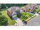 Overhead view of a well-maintained property with an attached garage, manicured lawn, and mature trees at 10106 Silverling Dr, Waxhaw, NC 28173