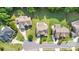 Aerial shot shows the layout of the neighborhood, featuring manicured lawns and mature trees at 10106 Silverling Dr, Waxhaw, NC 28173