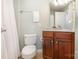 Bathroom featuring a tiled floor, white shower curtain, and wooden vanity with updated fixtures at 10106 Silverling Dr, Waxhaw, NC 28173