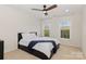 Bedroom featuring a ceiling fan, neutral carpet, and two windows providing lots of natural light at 10106 Silverling Dr, Waxhaw, NC 28173