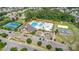 Aerial view of the community pool, clubhouse, tennis courts, playground, and parking area at 10106 Silverling Dr, Waxhaw, NC 28173
