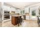 Well-equipped kitchen featuring an island, granite countertops and stainless appliances at 10106 Silverling Dr, Waxhaw, NC 28173