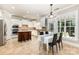 Bright kitchen with island, stainless steel appliances, and dining area at 10106 Silverling Dr, Waxhaw, NC 28173